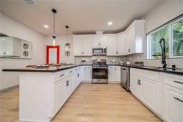 Interior, Kitchen, Pendant Lights, Recessed Lighting, Stainless Steel Appliances, Wood Texture Flooring