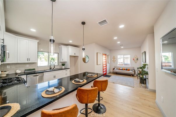 Dining room, Interior, Kitchen, Living room, Pendant Lights, Recessed Lighting, Stainless Steel Appliances, Wood Texture Flooring