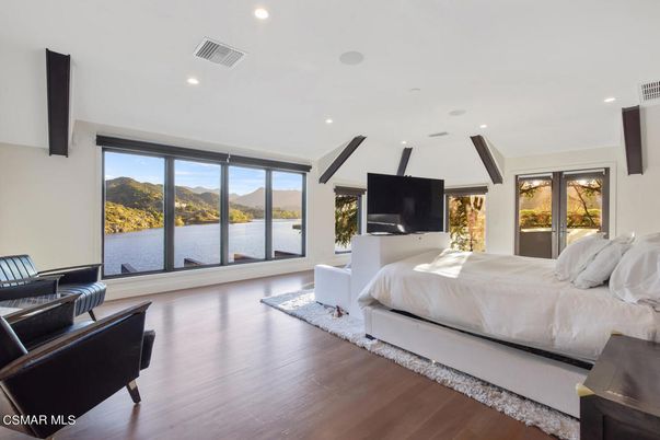 Bedroom, Fireplace, Interior, Recessed Lighting, Water, Wood Texture Flooring