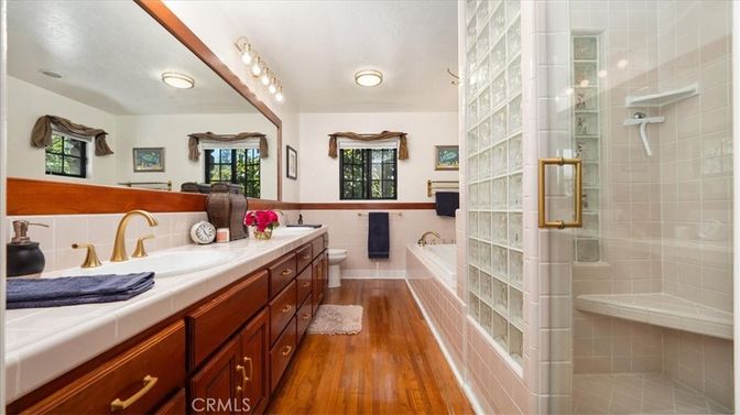 Bathroom, Dual Sink Vanities, Glass Shower, Interior, Tile Countertops, Wood Texture Flooring