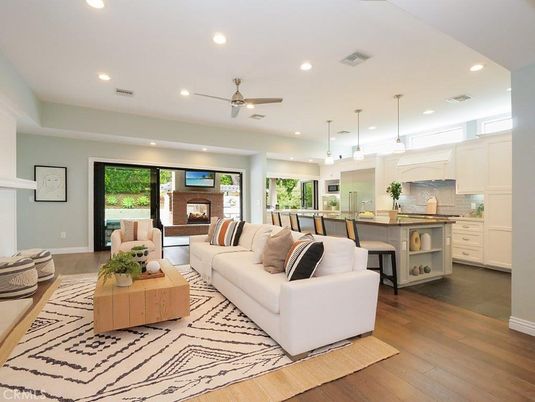 Fireplace, Interior, Kitchen, Living room, Pendant Lights, Recessed Lighting, Stainless Steel Appliances, Wood Texture Flooring