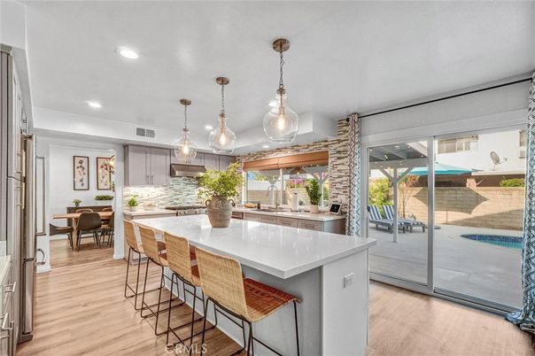 Dining room, Interior, Kitchen, Pendant Lights, Recessed Lighting, Stainless Steel Appliances, Wood Texture Flooring