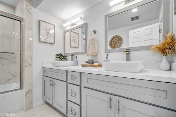 Bathroom, Dual Sink Vanities, Glass Shower, Interior, Marble, Marble Walls, Recessed Lighting