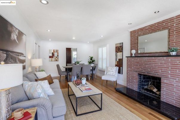 Dining room, Fireplace, Interior, Living room, Recessed Lighting, Stone Walls, Wood Texture Flooring