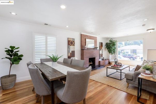 Dining room, Fireplace, Interior, Living room, Recessed Lighting, Wood Texture Flooring