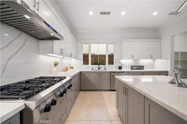 Interior, Kitchen, Marble Walls, Recessed Lighting, Stainless Steel Appliances