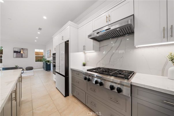 Interior, Kitchen, Marble Walls, Recessed Lighting, Stainless Steel Appliances