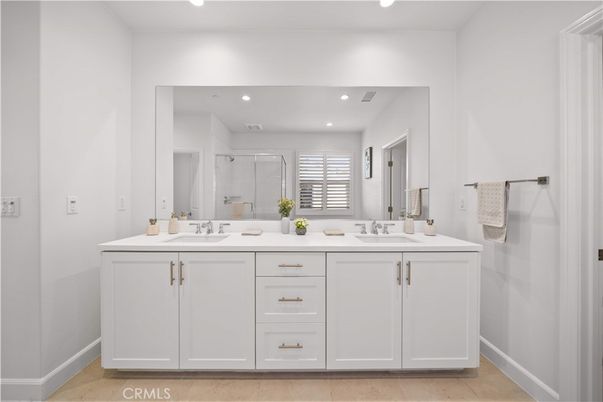 Bathroom, Dual Sink Vanities, Glass Shower, Interior, Recessed Lighting, Wood Texture Flooring