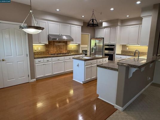 Interior, Kitchen, Pendant Lights, Recessed Lighting, Stainless Steel Appliances, Wood Texture Flooring