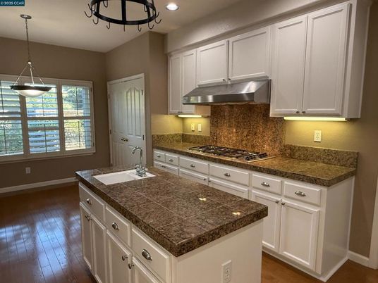 Interior, Kitchen, Pendant Lights, Recessed Lighting, Tile Countertops, Wood Texture Flooring