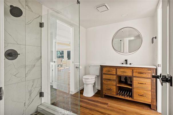 Bathroom, Glass Shower, Interior, Marble Walls, Recessed Lighting, Wood Texture Flooring