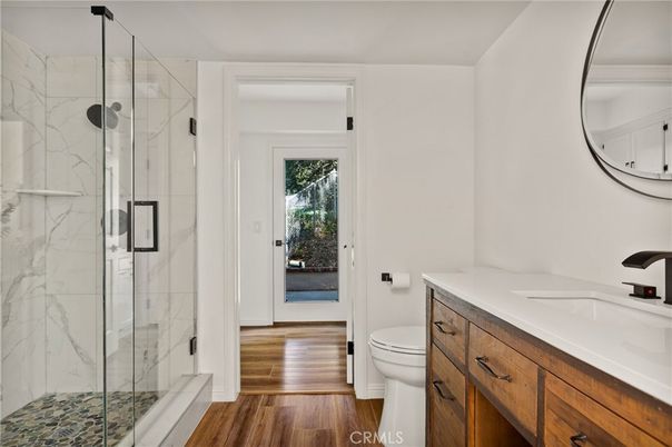 Bathroom, Glass Shower, Interior, Marble Walls, Wood Texture Flooring