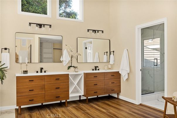 Bathroom, Dual Sink Vanities, Glass Shower, Interior, Marble Walls, Wood Texture Flooring