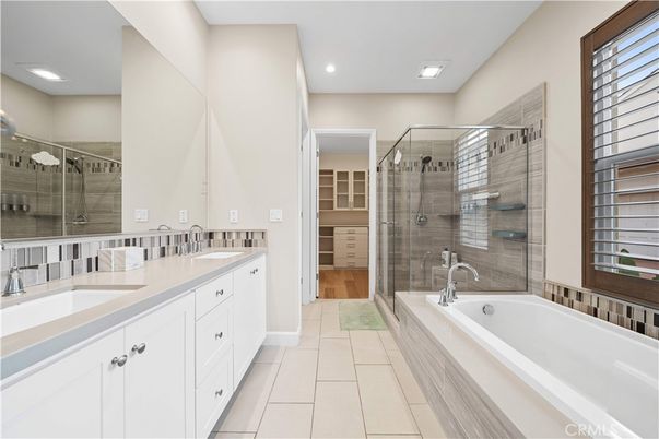 Bathroom, Dual Sink Vanities, Glass Shower, Interior, Recessed Lighting, Wood Texture Flooring