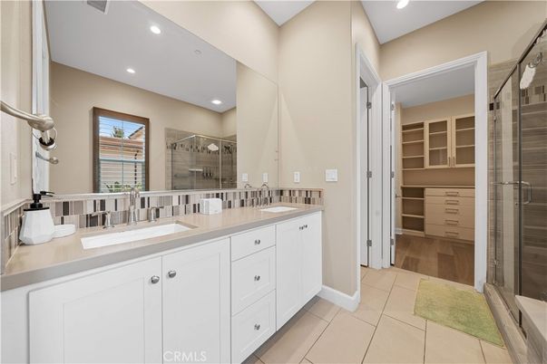 Bathroom, Dual Sink Vanities, Glass Shower, Interior, Recessed Lighting, Wood Texture Flooring