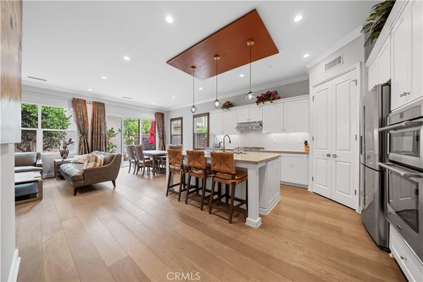 Dining room, Interior, Kitchen, Living room, Pendant Lights, Recessed Lighting, Stainless Steel Appliances, Wood Texture Flooring
