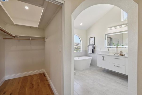 Bathroom, Dual Sink Vanities, Free Standing Baths, Interior, Recessed Lighting, Walk-in Closets, Wood Texture Flooring