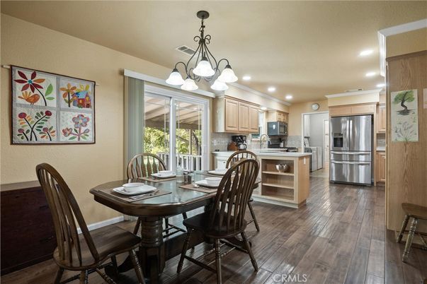 Chandelier, Dining room, Interior, Kitchen, Recessed Lighting, Stainless Steel Appliances, Wood Texture Flooring