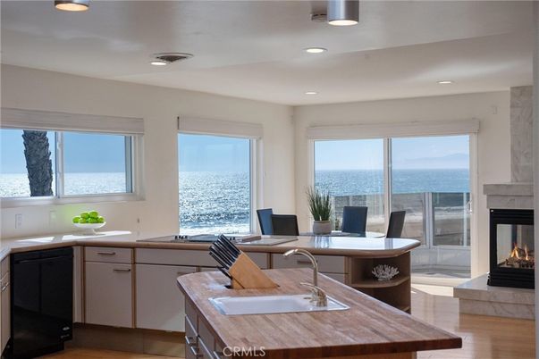 Dining room, Fireplace, Interior, Kitchen, Recessed Lighting, Water, Wood Texture Flooring