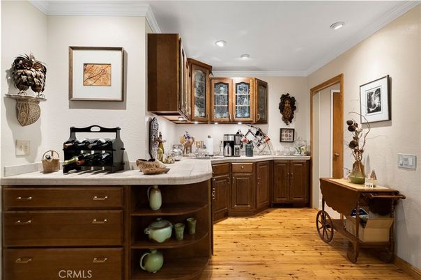 Interior, Kitchen, Recessed Lighting, Tile Countertops, Wood Texture Flooring