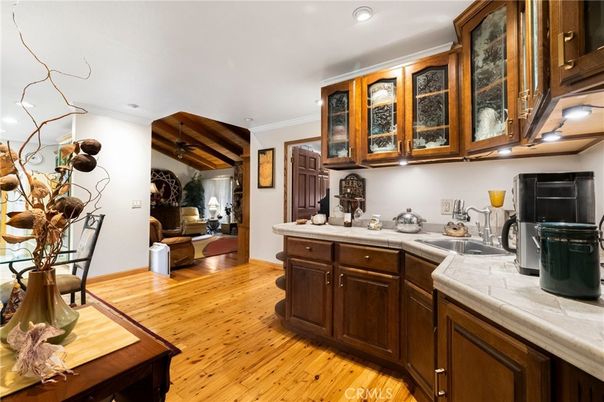 Interior, Kitchen, Recessed Lighting, Tile Countertops, Wood Texture Flooring