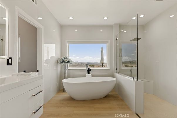 Bathroom, Dual Sink Vanities, Free Standing Baths, Glass Shower, Interior, Recessed Lighting, Wood Texture Flooring