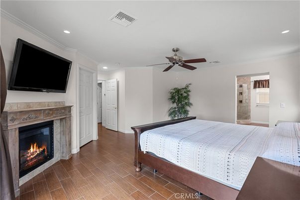 Bedroom, Fireplace, Interior, Recessed Lighting, Wood Texture Flooring