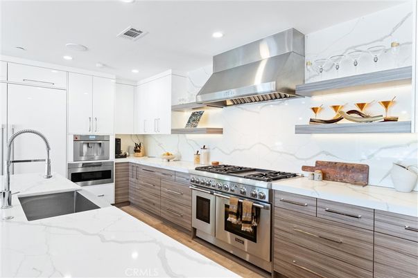 Interior, Kitchen, Marble Walls, Recessed Lighting, Stainless Steel Appliances