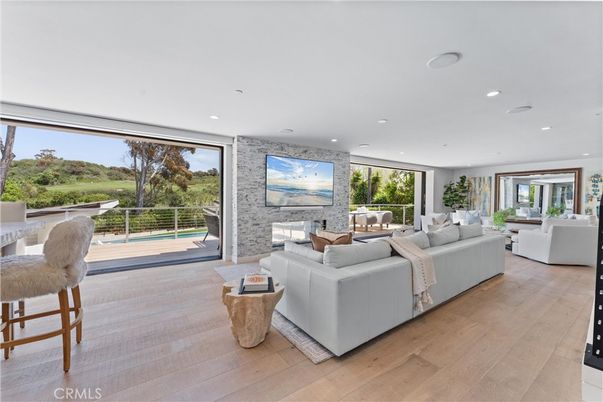Fireplace, Interior, Living room, Recessed Lighting, Stone Walls, Wood Texture Flooring