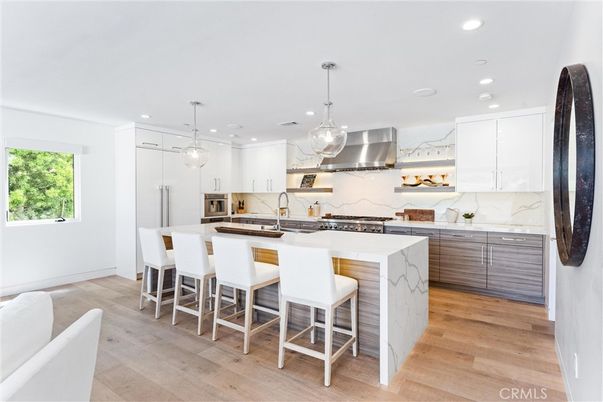 Interior, Kitchen, Marble Walls, Pendant Lights, Recessed Lighting, Stainless Steel Appliances, Wood Texture Flooring
