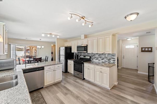 Dining room, Interior, Kitchen, Pendant Lights, Stainless Steel Appliances, Wood Texture Flooring