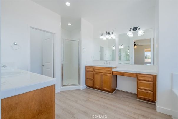 Bathroom, Dual Sink Vanities, Interior, Recessed Lighting, Tile Countertops, Wood Texture Flooring
