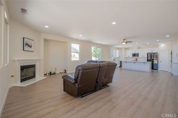 Fireplace, Interior, Kitchen, Living room, Recessed Lighting, Stainless Steel Appliances, Wood Texture Flooring