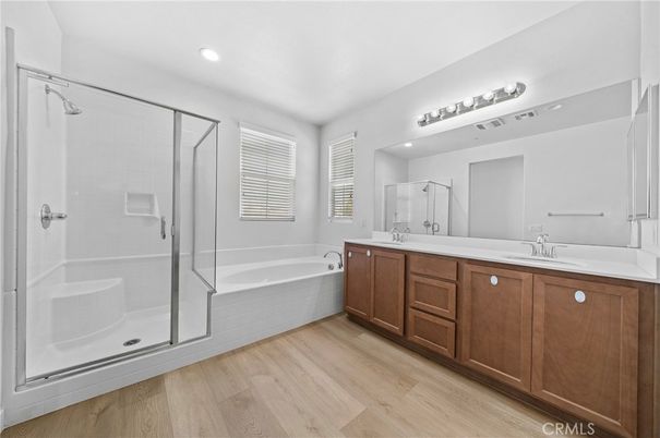 Bathroom, Dual Sink Vanities, Glass Shower, Interior, Recessed Lighting, Wood Texture Flooring