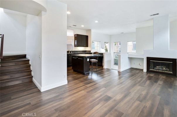 Empty room, Fireplace, Interior, Kitchen, Recessed Lighting, Wood Texture Flooring