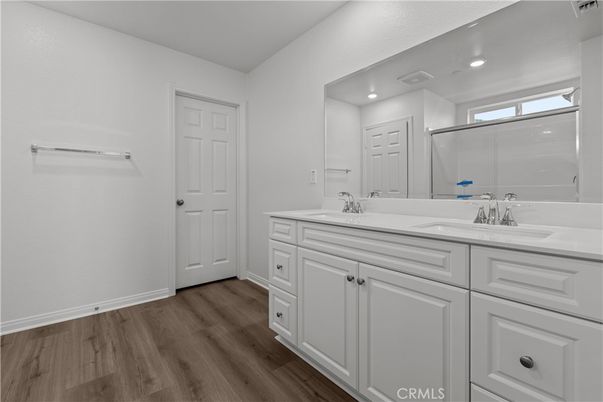 Bathroom, Dual Sink Vanities, Glass Shower, Interior, Recessed Lighting, Wood Texture Flooring