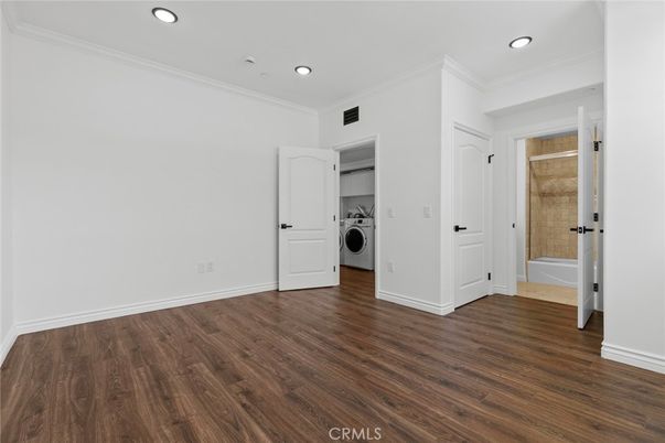 Empty room, Interior, Recessed Lighting, Utility Closets, Washer, Wood Texture Flooring