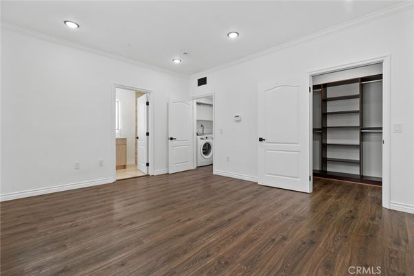 Empty room, Interior, Recessed Lighting, Utility Closets, Washer, Wood Texture Flooring