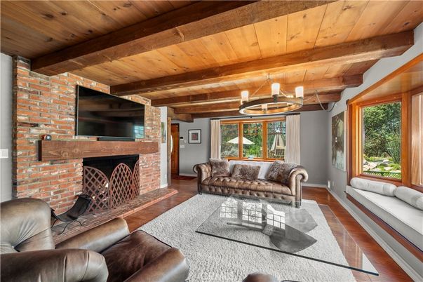 Chandelier, Fireplace, Interior, Living room, Stone Walls, Wooden Beams, Wooden Ceilings, Wood Texture Flooring