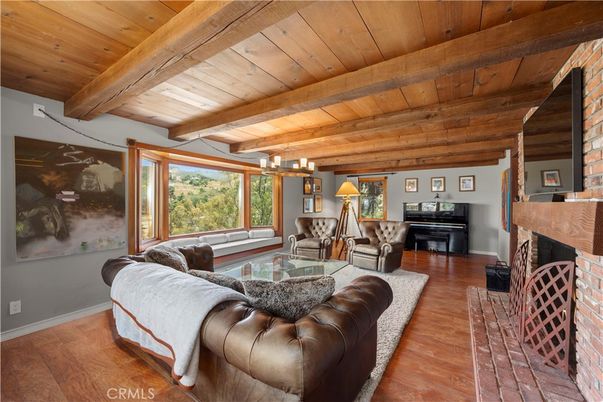 Chandelier, Fireplace, Interior, Living room, Piano, Wooden Beams, Wooden Ceilings, Wood Texture Flooring