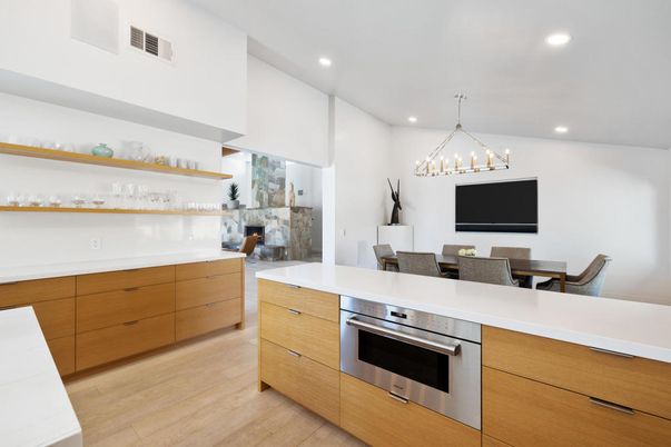 Chandelier, Dining room, Fireplace, Interior, Kitchen, Pendant Lights, Recessed Lighting, Stainless Steel Appliances, Wood Texture Flooring