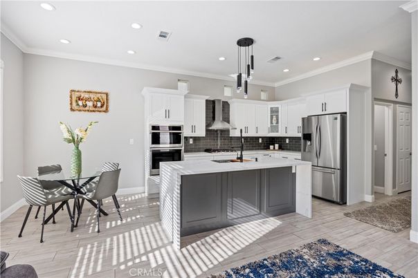 Dining room, Interior, Kitchen, Pendant Lights, Recessed Lighting, Stainless Steel Appliances, Wood Texture Flooring