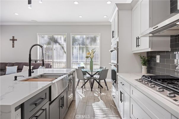 Dining room, Interior, Kitchen, Recessed Lighting, Stainless Steel Appliances, Wood Texture Flooring
