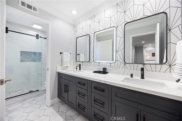 Bathroom, Dual Sink Vanities, Glass Shower, Interior, Marble, Marble Walls, Recessed Lighting
