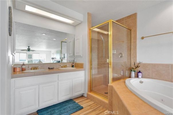 Bathroom, Dual Sink Vanities, Glass Shower, Interior, Recessed Lighting, Tile Countertops, Wood Texture Flooring