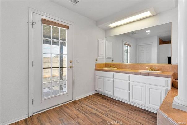 Bathroom, Dual Sink Vanities, Interior, Recessed Lighting, Tile Countertops, Wood Texture Flooring