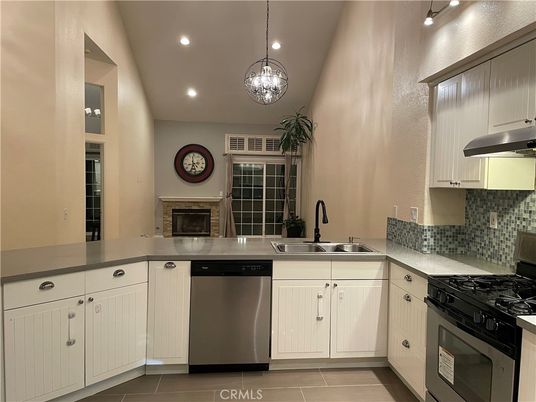 Fireplace, Interior, Kitchen, Pendant Lights, Recessed Lighting, Stainless Steel Appliances