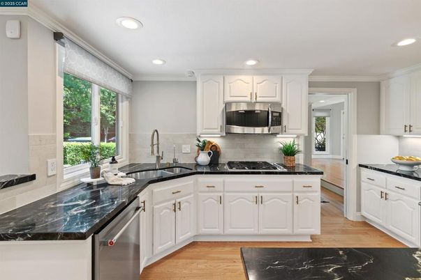 Interior, Kitchen, Recessed Lighting, Stainless Steel Appliances, Wood Texture Flooring