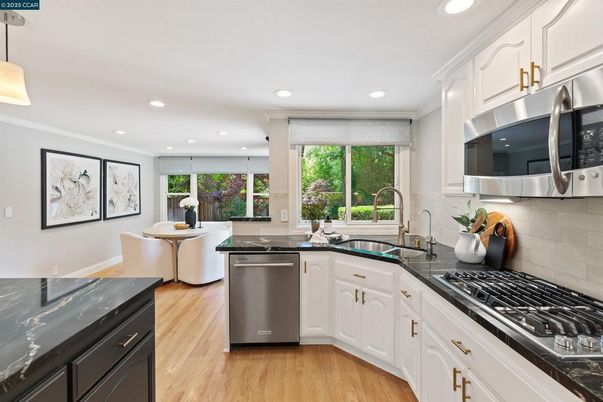 Dining room, Interior, Kitchen, Pendant Lights, Recessed Lighting, Stainless Steel Appliances, Wood Texture Flooring