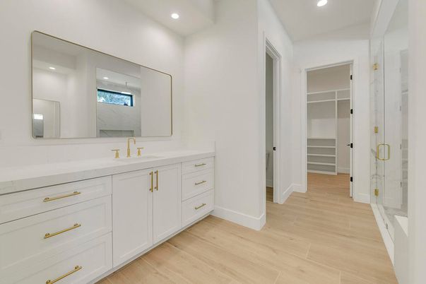 Bathroom, Dual Sink Vanities, Interior, Recessed Lighting, Walk-in Closets, Wood Texture Flooring